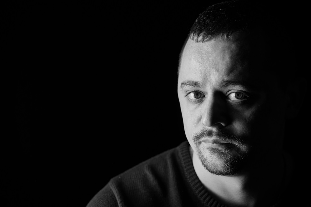 portrait,of,a,thoughtful,man,in,dramatic,black,and,white